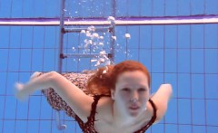 Redheaded Katka playing underwater