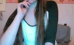 Shy brunette showing tits at webcam