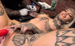 Amber Luke masturbates while getting tattooed