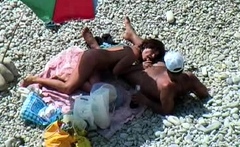 Blonde amateur couple enjoys oral sex on a public nude beach