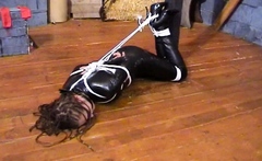 Sky hogtied in PVC catsuit