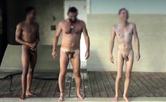 Four men at swimming pool